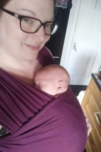 Kimmy Wearing her baby in a plum coloured Hana Wrap