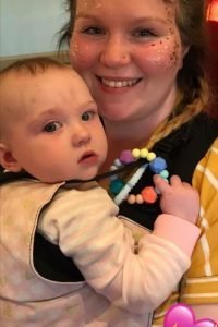 Hannah wearing her baby in an Integra carrier