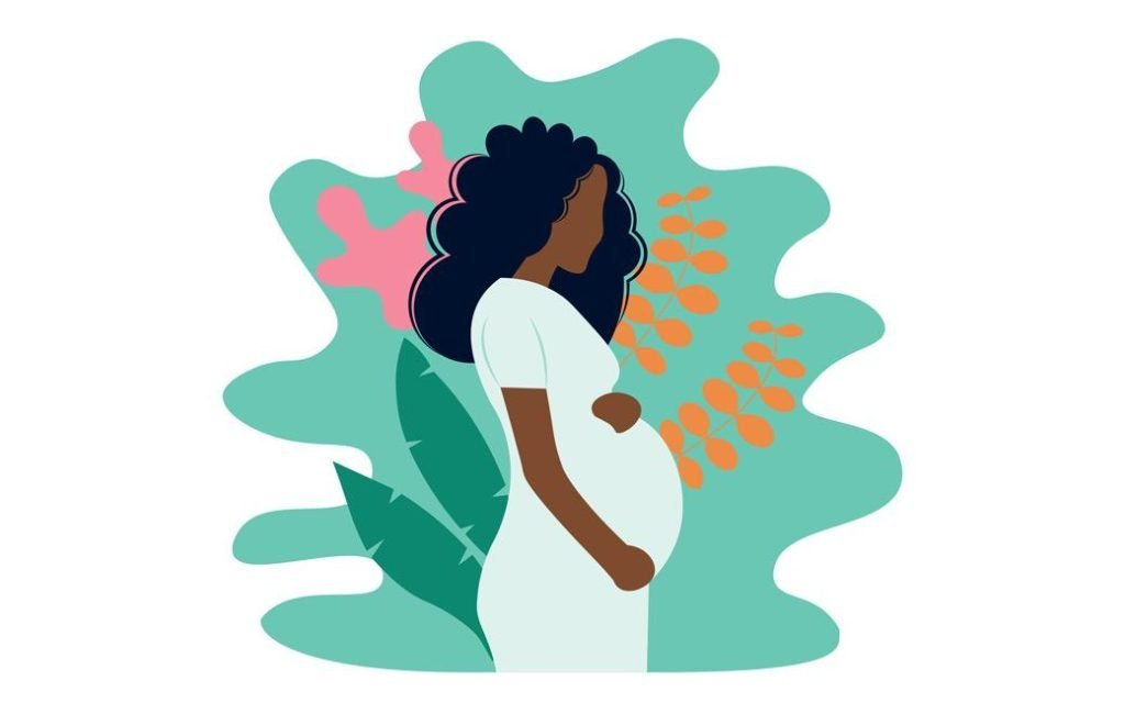 A pregnant person with dark skin and long, bushy hair holding their bump