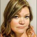 Headshot of Helen Parsons who is white, with shoulder length sandy coloured hair
